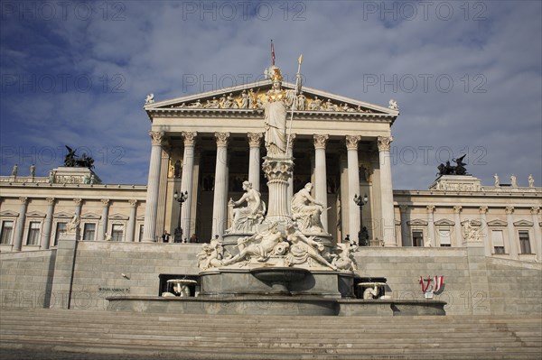 Parliament building with statue of Athena rising from fountain in front. Photo : Bennett Dean