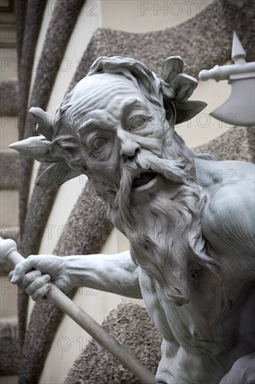 Detail of a figure on the Michaelertrakt the southern gateway into the Hofburg Palace. The statues and figures include Heracles the greatest of the Greek heroes and represent Austrias power over land and sea. Photo : Bennett Dean