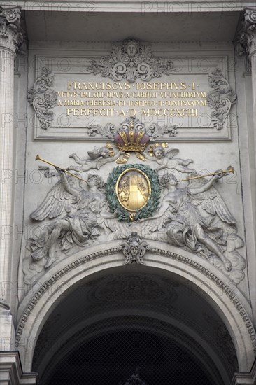 Inscription and sculpted figures above the Michaelertrakt gateway to the Hofburg Palace. Photo : Bennett Dean