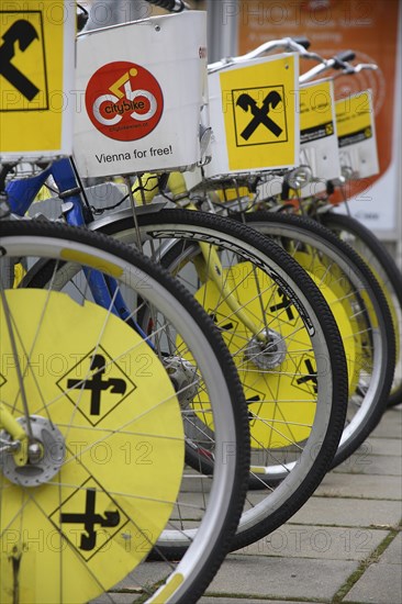 Cropped view of wheels of line of bicycles for public hire. Photo: Bennett Dean