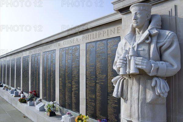 World War Two Naval memorial on Southsea seafront designed by Sir Edmund Maufe with sculpture by Sir Charles Wheeler of a sailor holding a pair of binoculars with the Roll Of Honour listing the fallen beyond. Photo: Paul Seheult