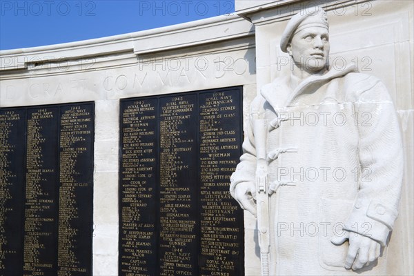 World War Two Naval memorial on Southsea seafront designed by Sir Edmund Maufe with sculpture by William McMillan of a Royal Marine Commando and the Roll Of Honour of the fallen beyond. Photo : Paul Seheult