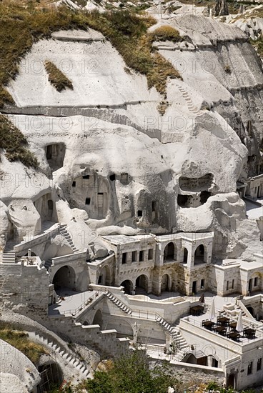 Cave hotel built into white tufa rock of hillside. Photo: Hugh Rooney