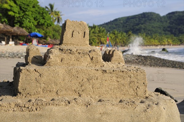 Mexico, Guerrero, Zihuatanejo, Playa la Ropa sandcastle on the beach. 
Photo : Nick Bonetti