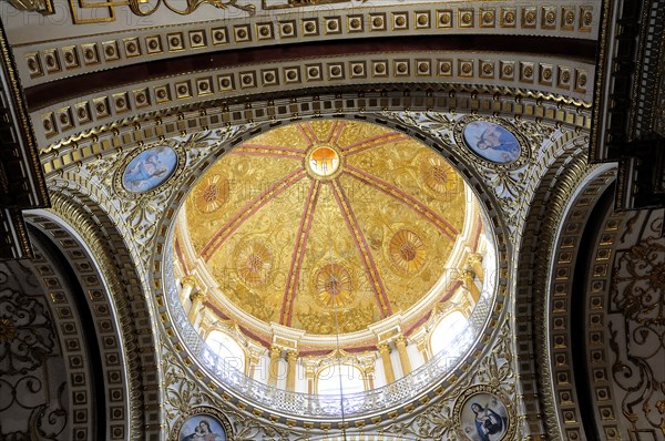 Mexico, Bajio, Zacatecas, Church of Guadalupe looking up at ornate interior ceiling of dome. 
Photo : Nick Bonetti