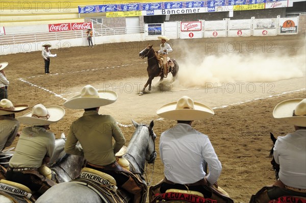 Mexico, Bajio, Zacatecas, Traditional horsemen or Charros competing in Mexican rodeo. 
Photo : Nick Bonetti