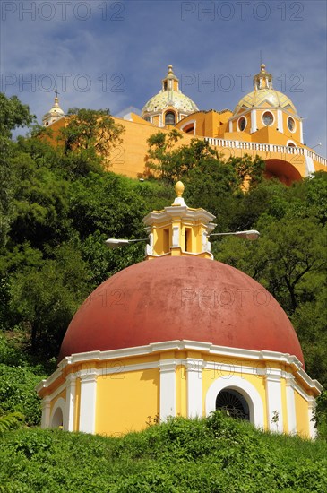 Mexico, Puebla, Cholula, Church of Neustra Senor de los Remedios on tree covered hillside above the pyramid ruins. 
Photo : Nick Bonetti