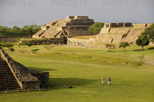 Mexico, Oaxaca, Monte Alban, Ruins of Los Danzantes and Monticulo buildings and central plaza. 
Photo : Nick Bonetti