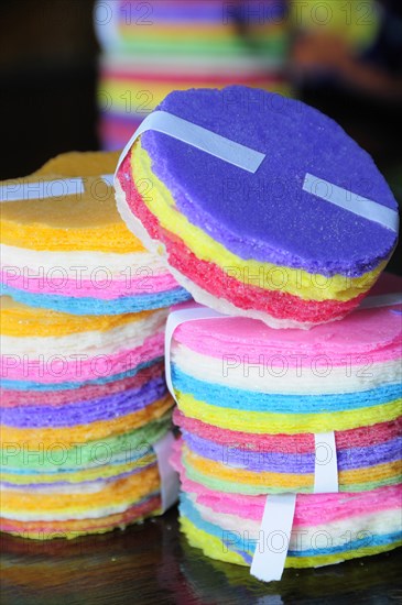 Mexico, Puebla, Food, Coloured rice paper snacks. 
Photo : Nick Bonetti