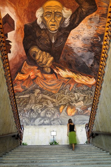 Mexico, Jalisco, Guadalajara, Palacio Gobierno or Government Palace Mural of Fr Miguel Hidalgo by Jose Orozco in 1937 with staircase & figure. 
Photo : Nick Bonetti