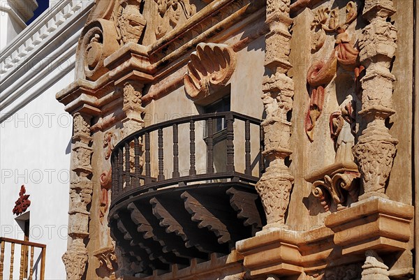 USA, Arizona, Tucson, Mission Church of San Xavier del Bac. Detail of balcony and carved window surround. 
Photo : Hugh Rooney