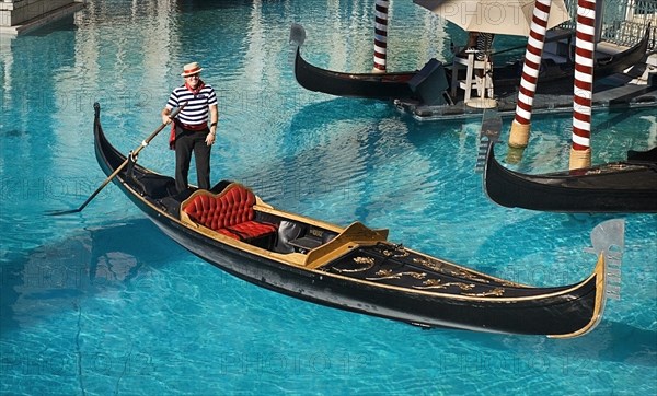 USA, Nevada, Las Vegas, The Strip gondola outside side the entrance to the Venetian hotel and casino. 
Photo : Hugh Rooney