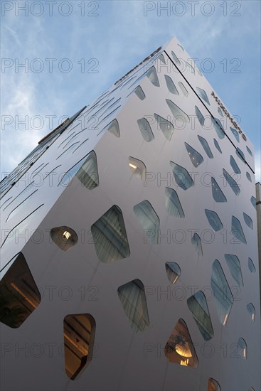 Japan, Honshu, Tokyo, Ginza. Part of the facade of the new Mikimoto Building with distinctive windows. 
Photo : Jon Burbank