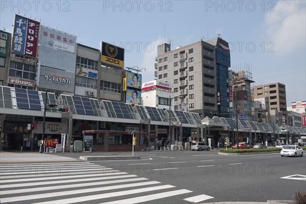 Japan, Honshu, Tokyo, Sugamo. The roof of arcade covering sidewalk used for solar electric and water heating panels. 
Photo : Jon Burbank
