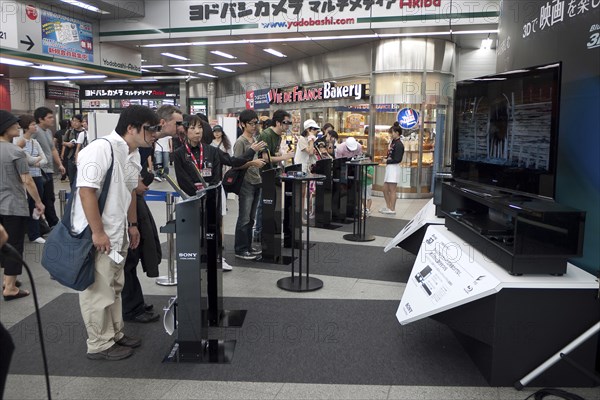 Japan, Honshu, Tokyo, Sony 3D televisions being demonstrated in shopping mall. 
Photo : Jon Burbank
