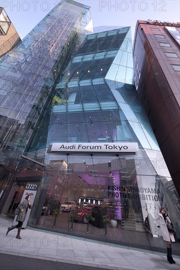 Japan, Honshu, Tokyo, Harajuku. Audi Forum building on Meiji-dori Avenue unusual glass fronted architecture. 
Photo : Jon Burbank