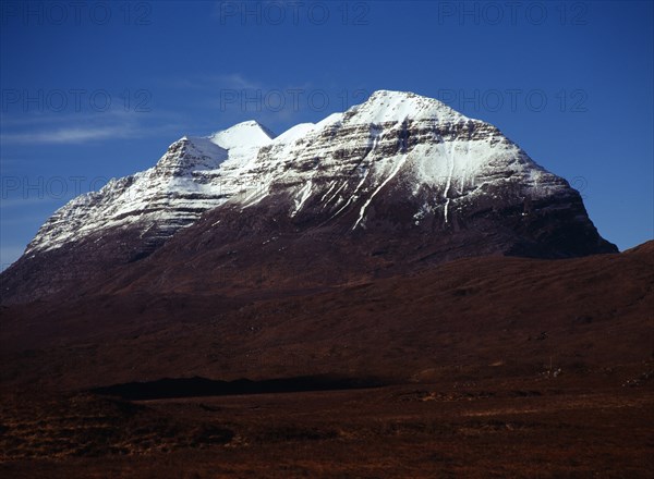 Scotland, Highlands, Torridon, View from Glen Torridon towards south east face of Liathach 1055 metres at highest point with snow topped summit. 
Photo : Bryan Pickering