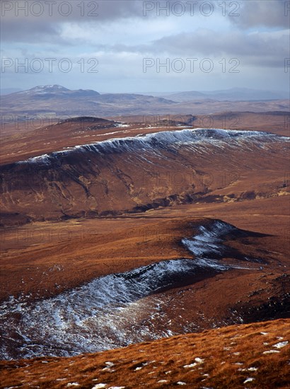 Scotland, Highlands, North, View north west from Ben Griam Mhor Mountain at 590 metres with snow capped ridges facing north east. 
Photo : Bryan Pickering