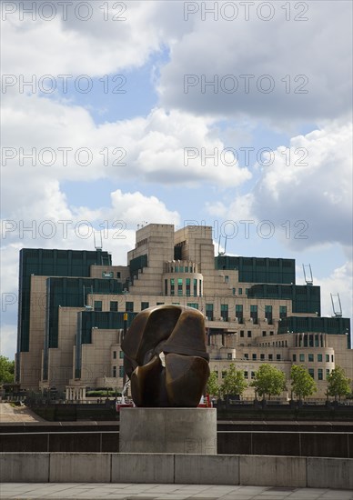 England, London, MI6 Headquarters on the Albert Embankment in Vauxhall seen from Millbank with a Henry Moore bronze Locking Piece sculpture in the foreground. 
Photo : Stephen Rafferty