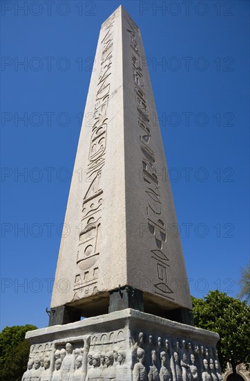 Turkey, Istanbul, Sultanahmet The Roman Hippodrome in At Meydani with Egyptian Obelisk with Hieroglyphics from Luxor and relief at base showing Theodosius I and courtiers. 
Photo : Paul Seheult