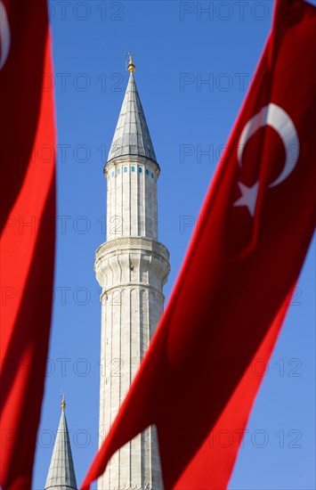 Turkey, Istanbul, Sultanahmet Haghia Sophia minaret and Turkish red flag with white crescent moon and star. 
Photo : Paul Seheult