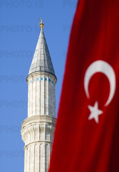 Turkey, Istanbul, Sultanahmet Haghia Sophia minaret and Turkish red flag with white crescent moon and star. 
Photo : Paul Seheult
