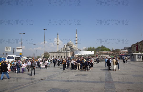 Turkey, Istanbul, Eminonu Yeni Camii New Mosque main square with people walking through. 
Photo : Stephen Rafferty