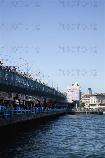 Turkey, Istanbul, Galata Bridge people fishing. 
Photo : Stephen Rafferty