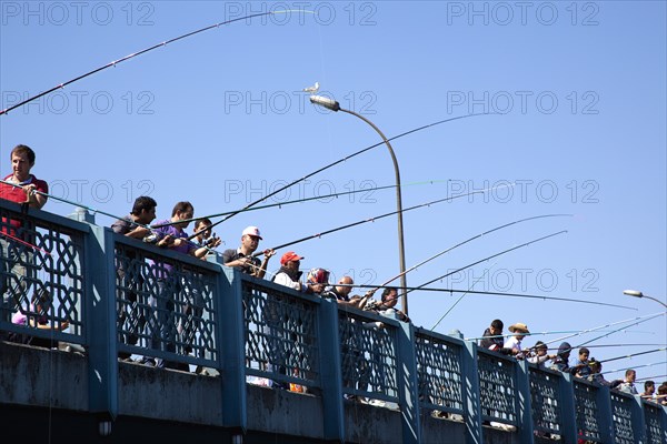 Turkey, Istanbul, Galata Bridge people fishing. 
Photo : Stephen Rafferty