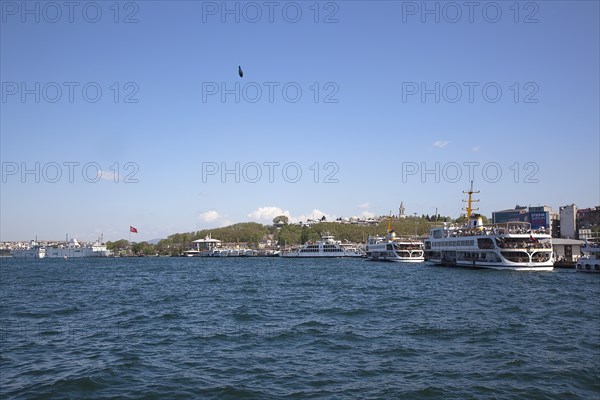 Turkey, Istanbul, Galata Bridge farries on Sirkeci quayside with fishermans line weight visible. 
Photo : Stephen Rafferty