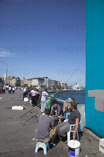 Turkey, Istanbul, Galata Bridge people fishing. 
Photo : Stephen Rafferty