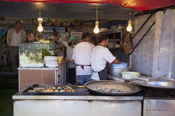Turkey, Istanbul, Karakoy Galata fish market stall selling freshly fried fish snacks. 
Photo : Stephen Rafferty