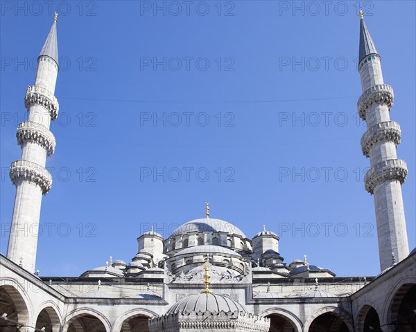 Turkey, Istanbul, Eminonu Yeni Camii New Mosque Domed roof and Minarets. 
Photo : Stephen Rafferty