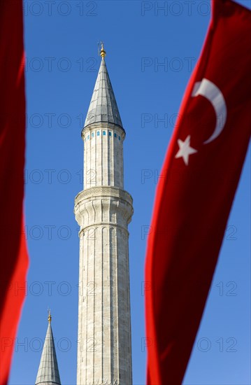 Turkey, Istanbul, Sultanahmet Haghia Sophia minaret and Turkish red flag with white crescent moon and star. 
Photo : Paul Seheult