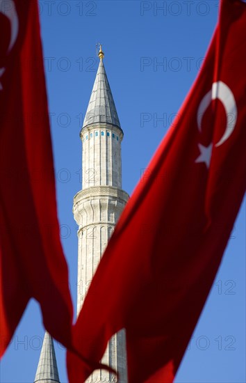 Turkey, Istanbul, Sultanahmet Haghia Sophia minaret and Turkish red flag with white crescent moon and star. 
Photo : Paul Seheult