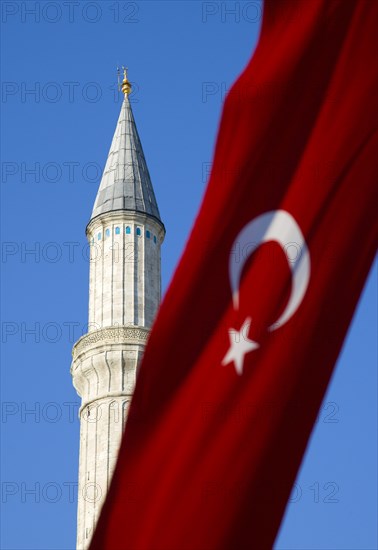 Turkey, Istanbul, Sultanahmet Haghia Sophia minaret and Turkish red flag with white crescent moon and star. 
Photo : Paul Seheult