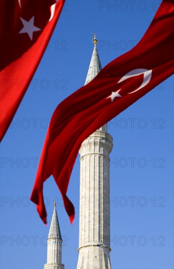 Turkey, Istanbul, Sultanahmet Haghia Sophia minaret and Turkish red flag with white crescent moon and star. 
Photo : Paul Seheult