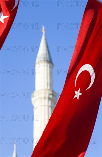 Turkey, Istanbul, Sultanahmet Haghia Sophia minaret and Turkish red flag with white crescent moon and star. 
Photo : Paul Seheult