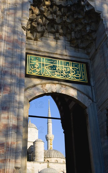 Turkey, Istanbul, Sultanahmet Camii The Blue Mosque Courtyard and minaret seen through the exit to the Hippodrome. 
Photo : Paul Seheult