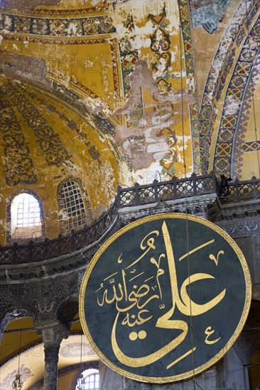 Turkey, Istanbul, Sultanahmet Haghia Sophia Christian murals and Muslim iconography in calligraphic roundels together in the domed interior. 
Photo : Paul Seheult