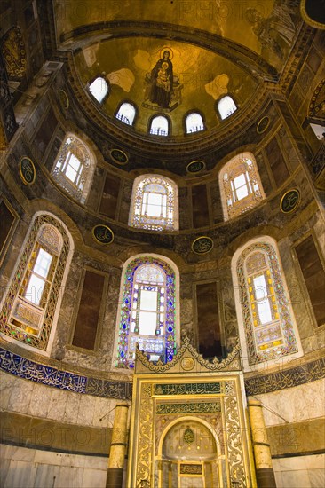 Turkey, Istanbul, Sultanahmet Haghia Sophia Christian mosaic of Virgin Mary and Infant Jesus and Muslim Mihrab indicating the direction of Mecca in a niche at the end of the nave. 
Photo : Paul Seheult