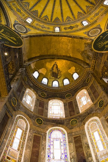 Turkey, Istanbul, Sultanahmet Haghia Sophia Christian murals and Muslim iconography in calligraphic roundels together in the domed interior. 
Photo : Paul Seheult