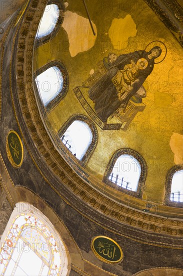 Turkey, Istanbul, Sultanahmet Haghia Sophia Mural of Virgin Mary holding the baby infant Jesus in the domed interior. 
Photo : Paul Seheult