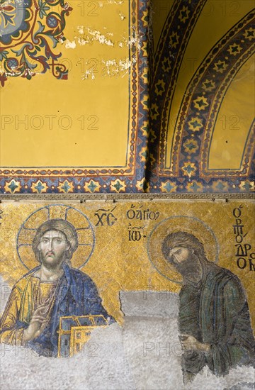 Turkey, Istanbul, Sultanahmet Haghia Sophia the 13th Century Deesis mosaic of Jesus Christ and St John The Baptist in the South Gallery. 
Photo : Paul Seheult