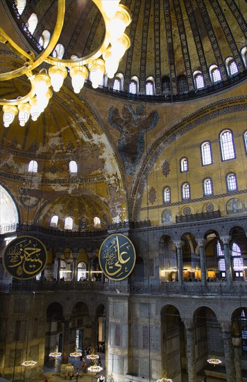 Turkey, Istanbul, Sultanahmet Haghia Sophia Christian murals and Muslim iconography in calligraphic roundels together in the domed interior. 
Photo : Paul Seheult