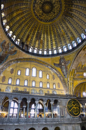 Turkey, Istanbul, Sultanahmet Haghia Sophia Christian murals and Muslim iconography in calligraphic roundels together in the domed interior. 
Photo : Paul Seheult