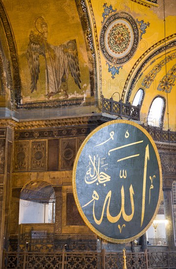 Turkey, Istanbul, Sultanahmet Haghia Sophia Christian murals and Muslim iconography in calligraphic roundels together in the domed interior. 
Photo : Paul Seheult