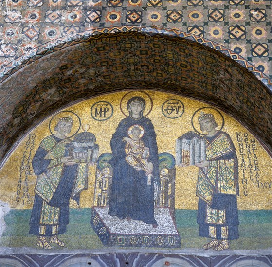 Turkey, Istanbul, Sultanahmet Haghia Sophia Mosaic of The Virgin Mary holding the Infant Jesus flanked by Emperors Constantine and Justinian above the doorway reserved for the Emperor. 
Photo : Paul Seheult