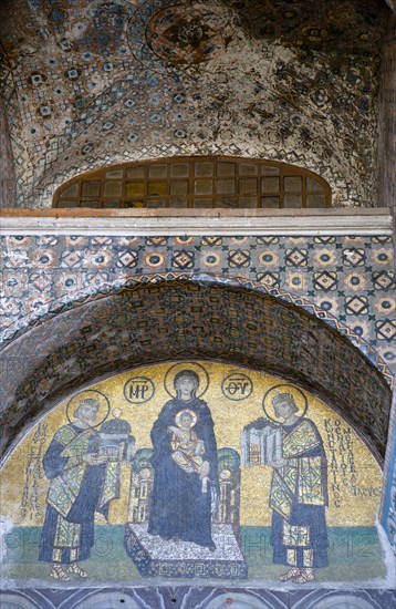Turkey, Istanbul, Sultanahmet Haghia Sophia Mosaic of The Virgin Mary holding the Infant Jesus flanked by Emperors Constantine and Justinian above the doorway reserved for the Emperor. 
Photo : Paul Seheult