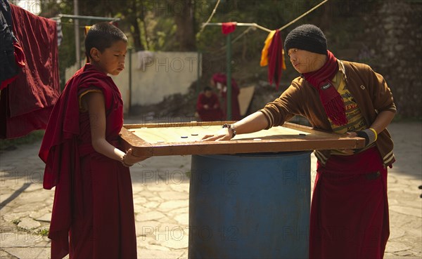 Buddhist Monks playing carrom, Sikkim, India